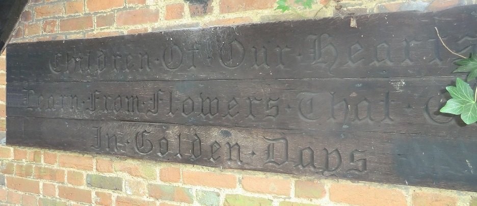 An inscription on a wooden plinth